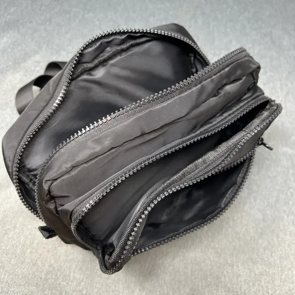 Bebe Black Nylon Belt Bag Fanny Pack Multi Pocket Crossbody Sling Travel 34-46
